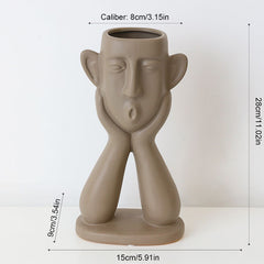 Ceramic face vase decoration