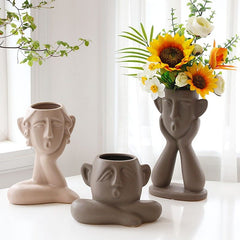 Ceramic face vase decoration